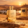 RASASI Hawas Elixir by Rasasi 100ml EDP — Gold bottle with ornate cap next to a textured gold box featuring a snake print label with Arabic and English text.
