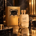 RASASI Hawas Elixir by Rasasi 100ml EDP — Gold bottle with ornate cap next to a textured gold box featuring a snake print label with Arabic and English text.