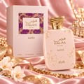 RASASI Hawas Glitz by Rasasi 100ml EDP — Pink perfume bottle with gold glitter accents and a textured gold cap, next to its matching pink box with a mosaic pattern.