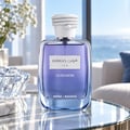 Kenz de Rasasi Hawas Ice Ultradose by Kenz de Rasasi 100ml Men — A clear glass perfume bottle with blue liquid, featuring a silver label with Arabic and English text, and a white rope-like cap.
