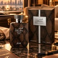 RASASI Hawas Private Terra by Rasasi 100ml EDP — A brown snakeskin-patterned perfume box and bottle with silver accents and a coiled snake cap