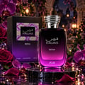 RASASI Hawas Reina by Rasasi 100ml EDP — Black and purple gradient box with intricate mosaic pattern, next to a clear glass perfume bottle with a gradient purple to black liquid and a textured silver cap.