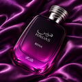 RASASI Hawas Reina by Rasasi 100ml EDP — Black and purple gradient box with intricate mosaic pattern, next to a clear glass perfume bottle with a gradient purple to black liquid and a textured silver cap.