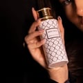 Maison Asrar Heritage by Maison Asrar 100ml EDP Unisex — White bottle with gold geometric pattern and gold fluted cap