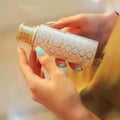 Maison Asrar Heritage by Maison Asrar 100ml EDP Unisex — White bottle with gold geometric pattern and gold fluted cap