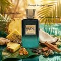 Khadlaj Island Extrait de Parfum — A perfume bottle with a dark green gradient and a gold textured cap sits next to its matching box, which features a white background with abstract green and gold marbling and palm leaf motifs. | Khadlaj Island Extrait de Parfum — Botol minyak wangi dengan gradien hijau gelap dan