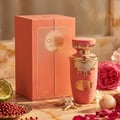 Lattafa Jouri Lattafa Women 100ml EDP — Pink perfume bottle with gold accents and a matching pink box, featuring sunburst design and Arabic script.