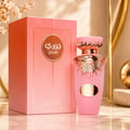 Lattafa Jouri Lattafa Women 100ml EDP — Pink perfume bottle with gold accents and a matching pink box, featuring sunburst design and Arabic script.