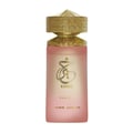 Paris Corner Khair Fusion Her 100ml — Red and gold patterned box next to a frosted pink perfume bottle with a gold textured cap. | Paris Corner Khair Fusion Her 100ml — Kotak corak merah dan emas di sebelah botol minyak wangi merah jambu beku dengan penutup bertekstur emas.