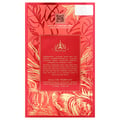Paris Corner Khair Fusion Her 100ml — Red and gold patterned box next to a frosted pink perfume bottle with a gold textured cap. | Paris Corner Khair Fusion Her 100ml — Kotak corak merah dan emas di sebelah botol minyak wangi merah jambu beku dengan penutup bertekstur emas.