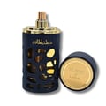 Lattafa Khalta Blend Of Lattafa Eau De Parfum 100ml — A dark blue perfume bottle with gold accents and a cutout design, next to its matching dark box and cap, all on a white reflective surface. | Lattafa Khalta Blend Of Lattafa Eau De Parfum 100ml — Botol minyak wangi biru gelap dengan aksen emas dan rekaan potongan