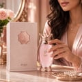 Zimaya Kibria Glory — Rose gold perfume bottle with crown cap and matching textured box, both featuring embossed Arabic script and 'KIBRIA GLORY' text.