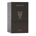 Bujairami Kingsman — A clear glass perfume bottle with a black leather band and gold accents sits next to its dark brown