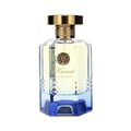 Maison Alhambra Kismet Lunar Magic 100ml — A clear glass perfume bottle with a gold cap and blue gradient base sits next to its matching blue and gold box on a white background. | Maison Alhambra Kismet Lunar Magic 100ml — Botol minyak wangi kaca jernih dengan penutup emas dan tapak gradien biru terletak di sebelah