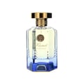 Maison Alhambra Kismet Lunar Magic 100ml — A clear glass perfume bottle with a gold cap and blue gradient base sits next to its matching blue and gold box on a white background. | Maison Alhambra Kismet Lunar Magic 100ml — Botol minyak wangi kaca jernih dengan penutup emas dan tapak gradien biru terletak di sebelah
