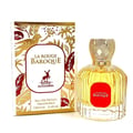 Maison Alhambra La Rouge Baroque 100ml — A perfume bottle with yellow liquid and a red label, next to its decorative box with gold and red leaf patterns and a deer logo. | Maison Alhambra La Rouge Baroque 100ml — Botol minyak wangi dengan cecair kuning dan label merah, bersebelahan dengan kotak hiasannya dengan corak
