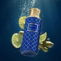 Maison Asrar Legacy by Maison Asrar 100ml EDP Unisex — Blue cylindrical box and matching perfume bottle with gold accents and intricate geometric pattern