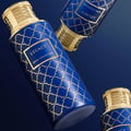 Maison Asrar Legacy by Maison Asrar 100ml EDP Unisex — Blue cylindrical box and matching perfume bottle with gold accents and intricate geometric pattern