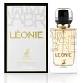 Maison Alhambra Leonie for Women by Maison Alhambra 100ml — A perfume bottle and its box are displayed side-by-side against a white background. The box is black and white with gold lettering and a deer logo. The bottle is clear glass with gold lettering and a deer logo. | Maison Alhambra Leonie for Women by Maison