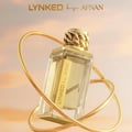 Afnan Lynked Forever by Afnan 100ml Eau De Parfum — A gold-capped perfume bottle stands next to its rose gold box with
