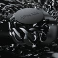 Afnan Lynked Freedom by Afnan — Gray gift box with embossed circle and text, next to a clear glass perfume bottle with black