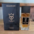 Bujairami Mafia Boss — Clear glass perfume bottle with gold liquid next to a black presentation box with gold logo and text