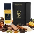 Bujairami Mafia Boss — Clear glass perfume bottle with gold liquid next to a black presentation box with gold logo and text