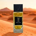 Bujairami Mafia Boss — Clear glass perfume bottle with gold liquid next to a black presentation box with gold logo and text
