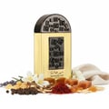 Lattafa Pride Maharjan Gold — A gold perfume bottle with a black and gold mosaic cap sits next to its matching ornate dark green box, both on a white background. | Lattafa Pride Maharjan Gold — Botol minyak wangi emas dengan penutup mozek hitam dan emas duduk di sebelah kotaknya yang berhias hijau gelap, kedua-duanya