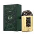 Lattafa Pride Maharjan Gold — A gold perfume bottle with a black and gold mosaic cap sits next to its matching ornate dark green box, both on a white background. | Lattafa Pride Maharjan Gold — Botol minyak wangi emas dengan penutup mozek hitam dan emas duduk di sebelah kotaknya yang berhias hijau gelap, kedua-duanya