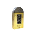 Lattafa Pride Maharjan Gold — A gold perfume bottle with a black and gold mosaic cap sits next to its matching ornate dark green box, both on a white background. | Lattafa Pride Maharjan Gold — Botol minyak wangi emas dengan penutup mozek hitam dan emas duduk di sebelah kotaknya yang berhias hijau gelap, kedua-duanya