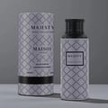 Maison Asrar Majesty by Maison Asrar 100ml EDP Unisex — A grey bottle with a repeating black quatrefoil pattern and a black textured cap, featuring a black label with 'MAJESTY' and 'ROYAL COLLECTION' text.