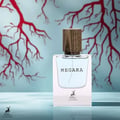 Maison Alhambra Megara 50ml Maison Alhambra — Brown cardboard box with red tree root design and text "MEGARA" next to a clear glass perfume bottle with blue liquid and a wooden cap, featuring the "Maison Alhambra" logo on both. | Maison Alhambra Megara 50ml Maison Alhambra — Kotak kadbod perang dengan reka bentuk akar