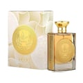 Ard Al Zaafaran Mithqal 100ml — A clear glass perfume bottle with gold liquid and a circular gold emblem, next to its white and gold patterned box with a matching emblem. | Ard Al Zaafaran Mithqal 100ml — Botol minyak wangi kaca jernih dengan cecair emas dan lambang emas bulat, bersebelahan dengan kotak corak putih