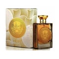 Ard Al Zaafaran Mithqal 100ml — A clear glass perfume bottle with gold liquid and a circular gold emblem, next to its white and gold patterned box with a matching emblem. | Ard Al Zaafaran Mithqal 100ml — Botol minyak wangi kaca jernih dengan cecair emas dan lambang emas bulat, bersebelahan dengan kotak corak putih