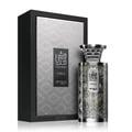 Zimaya Modhesh Noble 100ml — A silver patterned gift box stands next to a matching silver patterned perfume bottle with a metallic cap, both on a white background. | Zimaya Modhesh Noble 100ml — Kotak hadiah bercorak perak berdiri di sebelah botol minyak wangi bercorak perak yang sepadan dengan penutup logam