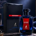 Maison Alhambra Moondrift Blue Intense 100ml Alhambra — A blue glass perfume bottle with a red label and a matching blue box with a red label, both featuring a deer logo and text. | Maison Alhambra Moondrift Blue Intense 100ml Alhambra — Botol kaca biru dengan label merah dan kotak biru sepadan dengan label merah