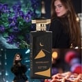 Gulf Orchid Moonlight Eau De Parfum — Black bottle with gold desert dunes and crescent moon design, gold cap | Gulf Orchid Moonlight Eau De Parfum — Botol hitam dengan reka bentuk bukit pasir emas dan bulan sabit, penutup emas