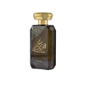 Lattafa Musk Al Aroos by Lattafa 80ml EDP — A black perfume box with gold ornate cutouts and Arabic calligraphy sits next to a dark glass perfume bottle with a gold cap and matching ornate design. | Lattafa Musk Al Aroos by Lattafa 80ml EDP — Kotak minyak wangi hitam dengan potongan berukir emas dan kaligrafi Arab