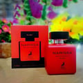 Maison Alhambra Narissa Ruby Rouge Maison Alhambra 100ml — A red perfume bottle and its matching red box are displayed against a white background. | Maison Alhambra Narissa Ruby Rouge Maison Alhambra 100ml — Sebotol minyak wangi merah dan kotak merah yang sepadan dipaparkan berlatarkan putih.