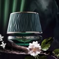 Maison Asrar Never Forget Me by Maison Asrar 90ml EDP Women — Green textured box lid open, revealing a dark bottle with gold accents and textured interior.