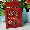 Rave Now Rouge Perfume EDP 100ml by RAVE — A red box with a geometric pattern sits next to an orange perfume bottle with a similar geometric cutout design. | Rave Now Rouge Perfume EDP 100ml by RAVE — Kotak merah dengan corak geometri terletak di sebelah botol minyak wangi oren dengan reka bentuk potongan geometri