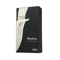 French Avenue Obsidian Eau De Parfum 100ml — A gold and black perfume bottle with ornate gold detailing stands next to its matching black box with gold artistic accents. | French Avenue Obsidian Eau De Parfum 100ml — Botol minyak wangi emas dan hitam dengan perincian emas berukir berdiri di sebelah kotak hitamnya yang
