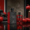 Maison Alhambra Opera Rouge — A deep red, rectangular perfume bottle with a black textured cap and a silver label reading "OPERA ROUGE EAU DE PARFUM" and a deer logo below, stands next to its matching black and red box. | Maison Alhambra Opera Rouge — Botol minyak wangi berbentuk segi empat berwarna merah pekat dengan