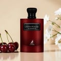 Maison Alhambra Opera Rouge — A deep red, rectangular perfume bottle with a black textured cap and a silver label reading "OPERA ROUGE EAU DE PARFUM" and a deer logo below, stands next to its matching black and red box. | Maison Alhambra Opera Rouge — Botol minyak wangi berbentuk segi empat berwarna merah pekat dengan