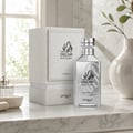 Zimaya Oscar Platinum — Silver perfume bottle and its grey textured box packaging, both featuring black Arabic calligraphy and text.