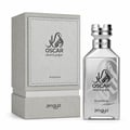 Zimaya Oscar Platinum — Silver perfume bottle and its grey textured box packaging, both featuring black Arabic calligraphy and text.
