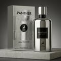 Maison Alhambra Panther Pour Homme — White glass perfume bottle with a dark label and a white box with embossed text and a deer logo. | Botol minyak wangi kaca putih Maison Alhambra Panther Pour Homme dengan label gelap dan kotak putih bertekstur timbul serta logo rusa.