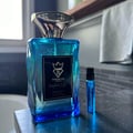 Bujairami Perfect Life — Blue glass perfume bottle with gold cap next to matching blue box with gold logo.