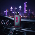 perfume 9 PM Rebel di dashboard kereta dengan lampu neon bandar Malaysia malam
